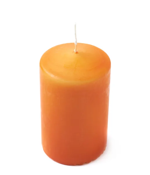 Egyetlen narancs viasz gyertyát elszigetelt — Stock Fotó