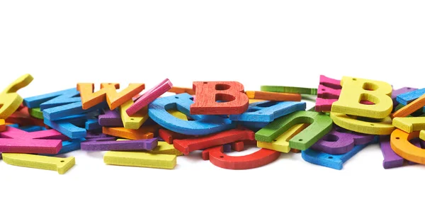 Rij gemaakt van kleurrijke brieven geïsoleerd — Stockfoto