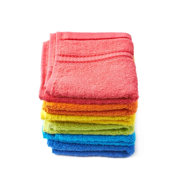 Pile of rainbow colored towels isolated — Stock Photo, Image