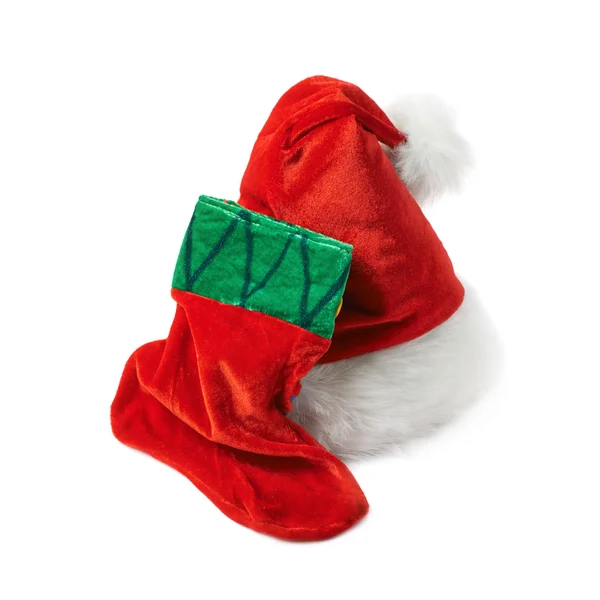 Santas hatt och Julstrumpa isolerade — Stockfoto