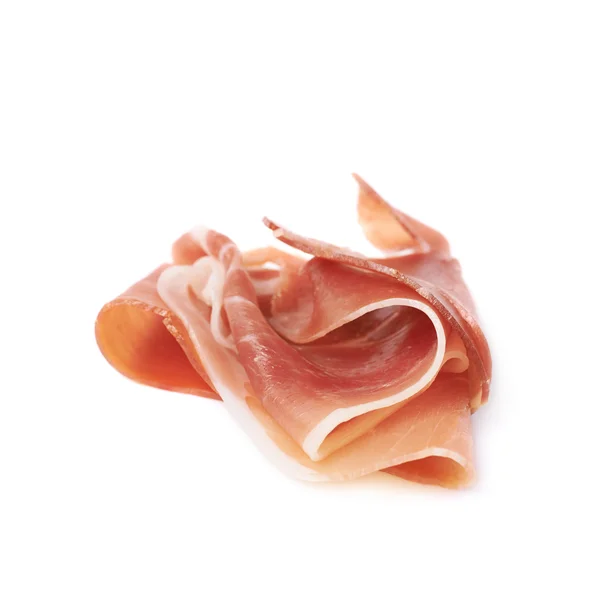 Gevouwen prosciutto-ham segment geïsoleerd — Stockfoto