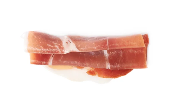 Hajtogatott prosciutto sonka szelet elszigetelt — Stock Fotó