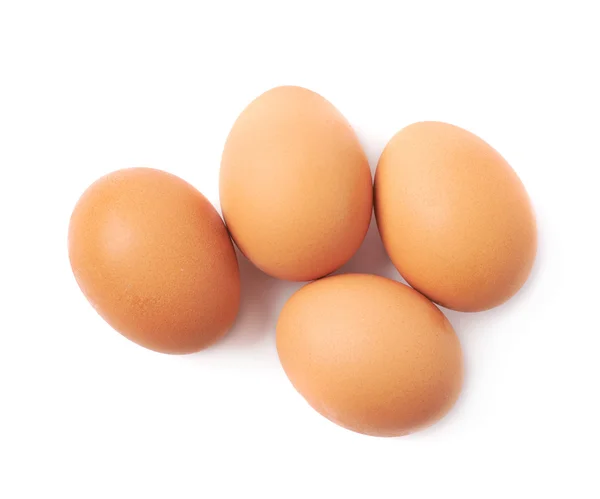 Выделено четыре коричневых яйца — стоковое фото