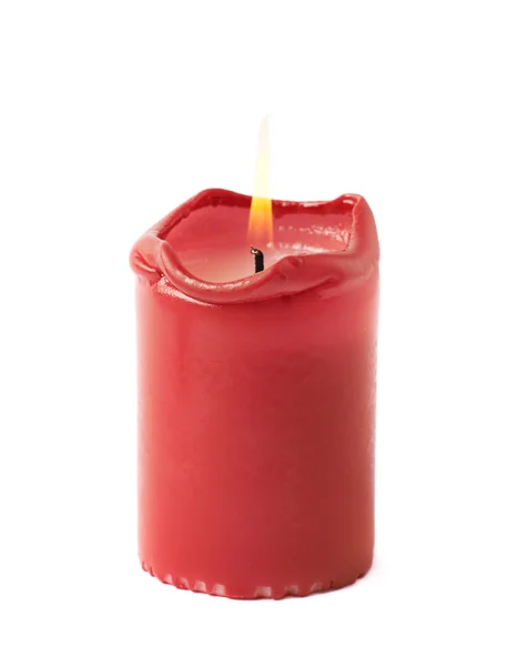 Half-verbrand verlichte rode kaars geïsoleerd Stockfoto