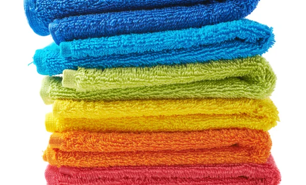 Pile of rainbow colored towels isolated — Stock Photo, Image