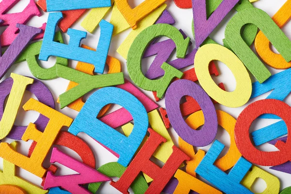Powierzchnia pokryta kolorowe litery — Zdjęcie stockowe