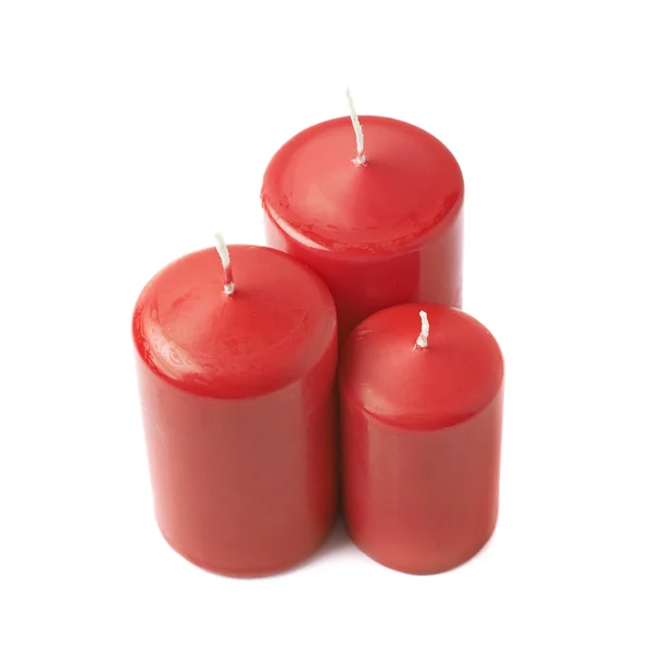 Tres velas de cera roja aisladas —  Fotos de Stock