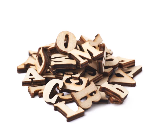 Haufen Holzbuchstaben isoliert — Stockfoto