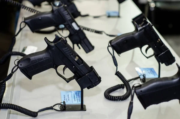 Handgun store shelves. A handgun for sale in the store.