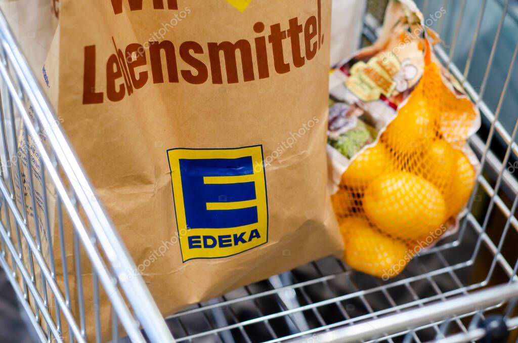 Soest, Germany - August 7, 2021: Edeka shopping bag in the shopping trolley