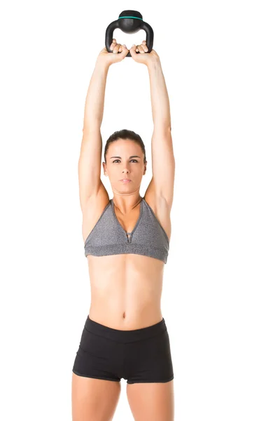 Mulher trabalhando com um Kettlebell — Fotografia de Stock