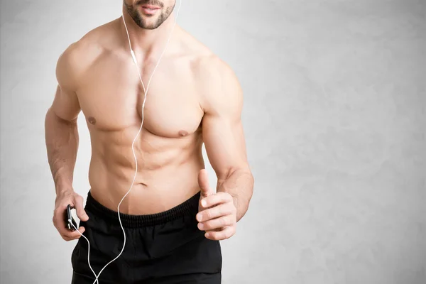 Homme écoutant de la musique et faisant du jogging — Photo