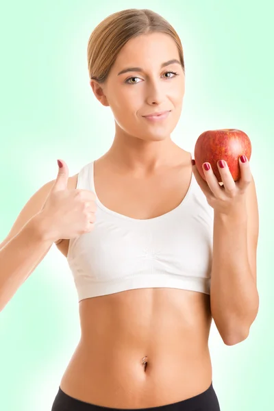 Жінка проведення яблуко — стокове фото