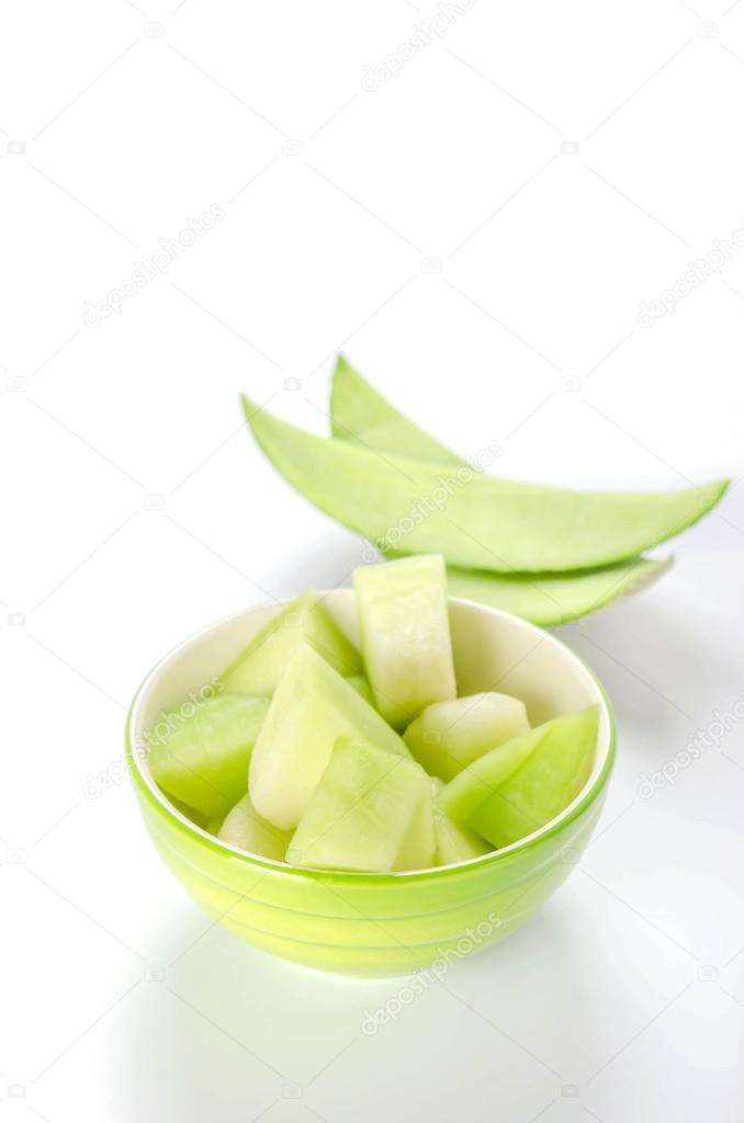 green melon in bowl