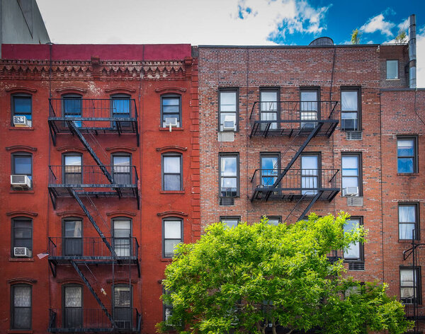 New York City, USA, May 2019, view of some red brick buildings with fire escapes in the Chelsea neighborhood