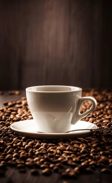 Cup of coffee on beans background — Stock Photo, Image