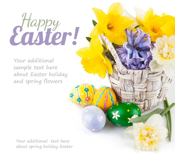 Easter eggs with spring flowers in basket — Stock Photo, Image