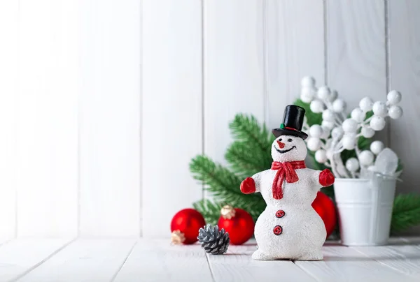 Snowman with christmas fir and balls — Stock Photo, Image