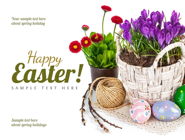 Easter eggs with spring flowers in basket — Stock Photo, Image