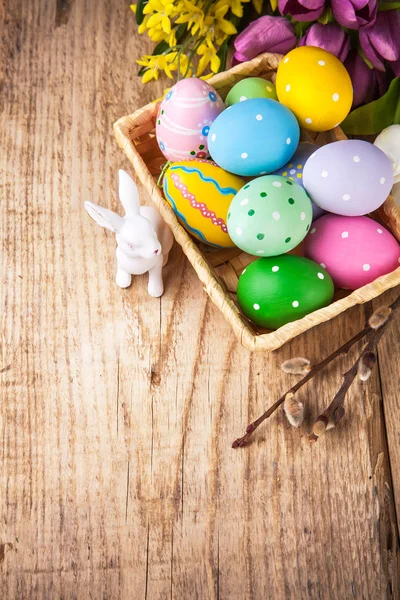 Easter still life with basket eggs rabbit — Stock Photo, Image