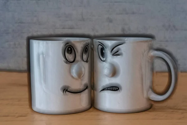 Cheerful Sad Cups — Stock Photo, Image