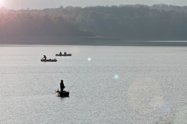 Fishermen in a boat — Stock Photo, Image