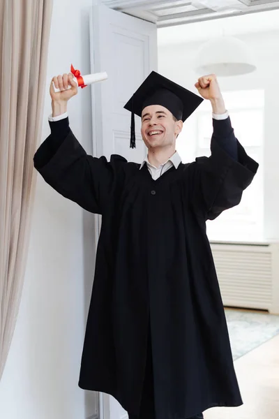 Caucasian young man feeling very excited to receive his bachelors degree — Stock Photo, Image