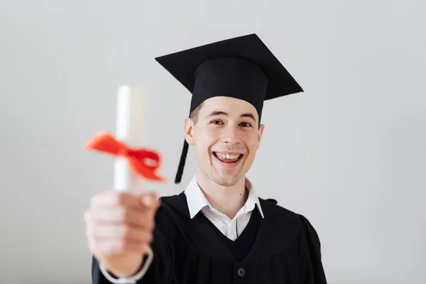 Caucasian young man feeling very excited to receive his bachelors degree — Stock Photo, Image