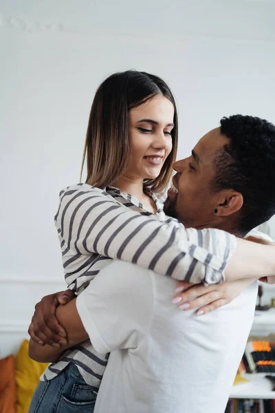 Mixed race couple dancing at home — Stock Photo, Image