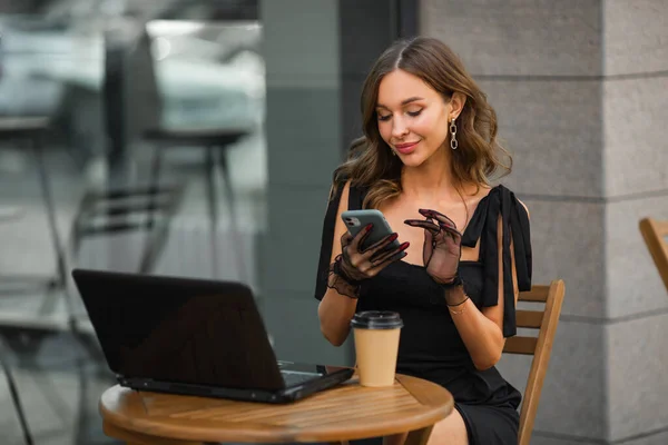 successful beautiful woman with makeup with laptop and mobile phone