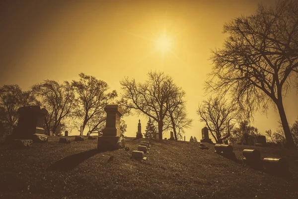 Old cemetery - vintage look with sun light — Stock Photo, Image