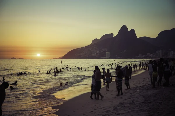 People relaxing on Ipanema Beach