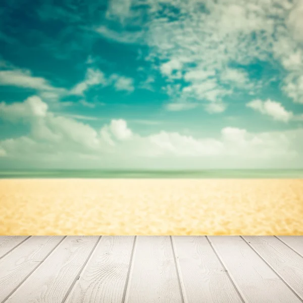 Empty blurred beach with wooden boards — Stock Photo, Image