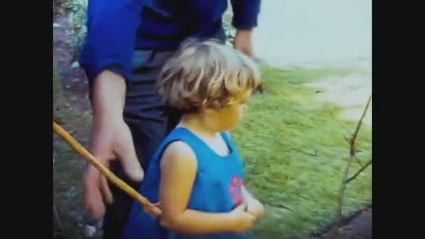 United Kingdom 1966, Child play in the Garden with Grandfather — Stock Video