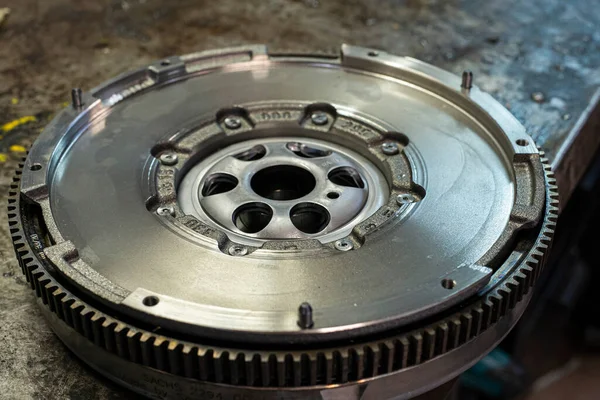 Detail of Car flywheel in a workshop, car spare parts