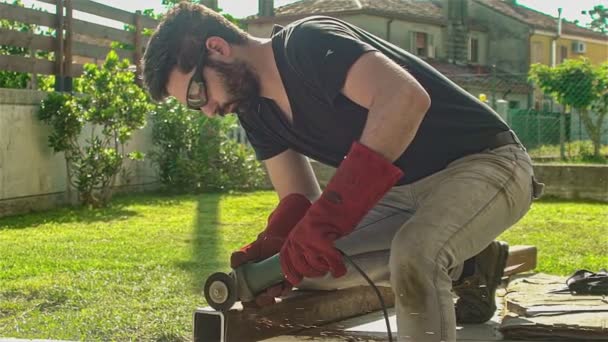 Worker Angle Grinder Cuts Iron Profile Construction Site — Stock Video