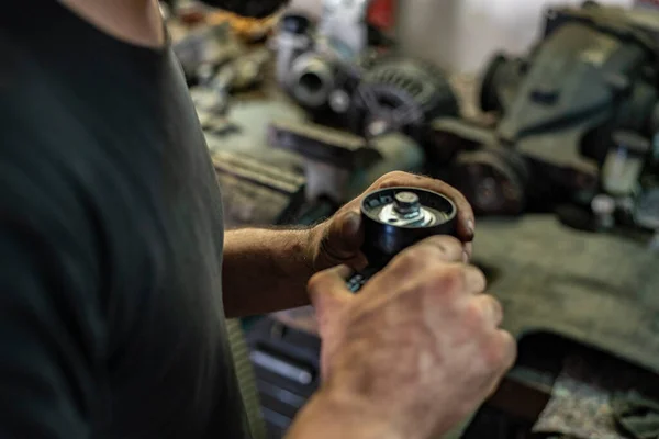 Detail of Auto parts in the hands of the mechanic