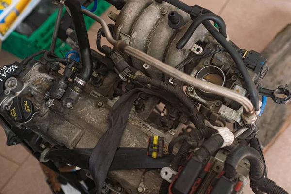 Detail of Old broken car engine at the junkyard