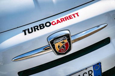 Rome, italy 10 september 2025: abarth car front detail showing the iconic emblem and turbo garrett branding, representing automotive performance and tuning