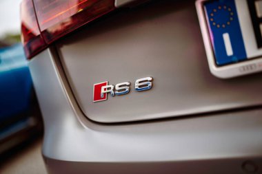 Rome, italy 10 september 2025: audi rs6 emblem and taillight detail on a high-performance luxury wagon with european license plate, chrome badge and sleek styling