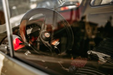 Rome, italy 10 september 2025: close-up of classic car interior showcasing vintage steering wheel and dashboard details, evoking retro elegance and nostalgia