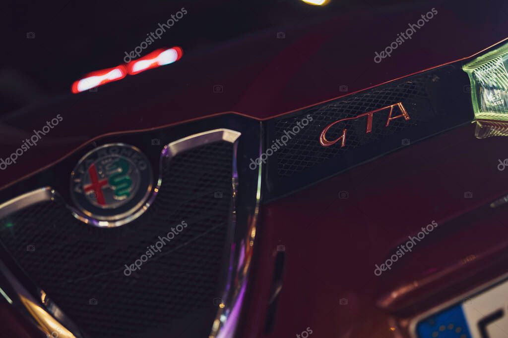 Este, italy 28 october 2025: alfa romeo gta front grille close-up with iconic logo and gta emblem, showcasing italian sports car design, luxury and performance