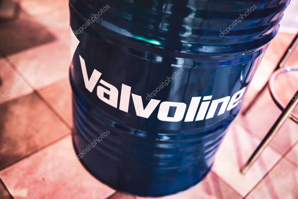 Milan, italy 28 october 2025: valvoline logo printing on a blue metal oil barrel, representing the automotive lubricating industry and motor oil products