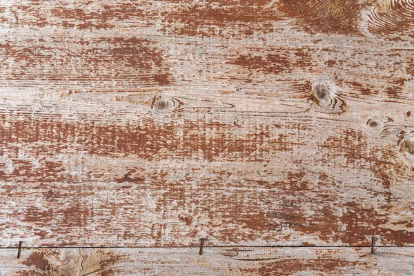 Kırsal eskimiş bir dokunun olduğu eski ahşap tahta. Kahverengi boya ve görünür tahıllar. Tasarım temaları için eski ve grunge bir arkaplan yaratıyor.