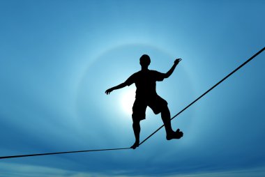 Man balancing on the rope concept of challenge and risk taking clipart