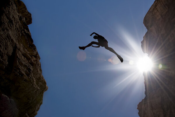 Man Jump through the Gap in the Mountain