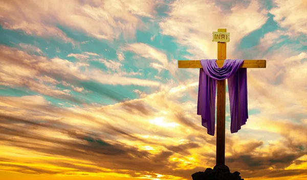 Christian cross over bright sunset background — Stock Photo, Image