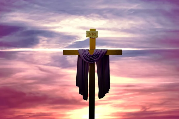 Christian cross over bright sunset background — Stock Photo, Image