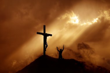 Dramatic sky scenery with a mountain cross and a worshiper clipart