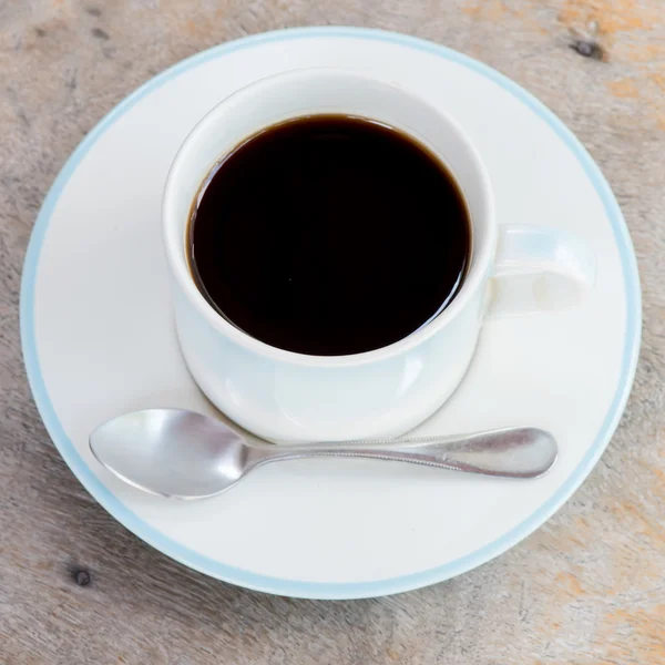 Tazza di caffè sul vecchio tavolo — Foto Stock